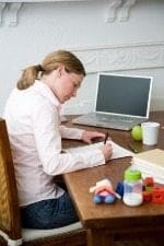 iStock_000005472659_150x225 Woman at desk with toys in foreground